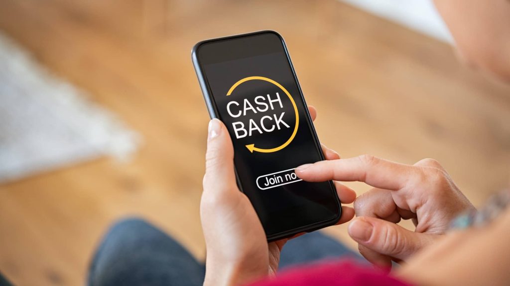 Woman using cashback app on phone