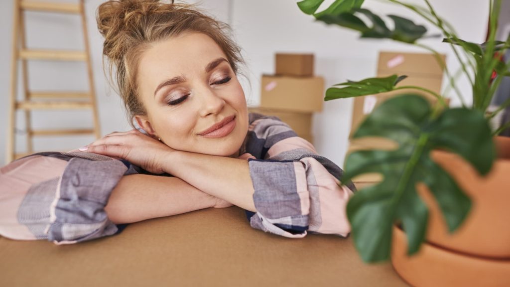 Young woman enjoying the new apartment